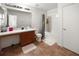 Clean bathroom with tub, shower, and vanity at 17539 Balmaha Dr, Land O Lakes, FL 34638