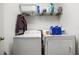 Laundry room with washer, dryer and shelving at 17539 Balmaha Dr, Land O Lakes, FL 34638