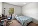 Small bedroom with a single bed and desk at 17539 Balmaha Dr, Land O Lakes, FL 34638