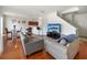 Living room with hardwood floors, couches and a view of the kitchen at 17539 Balmaha Dr, Land O Lakes, FL 34638
