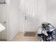 Neat entryway with tiled floor and shoe storage at 17539 Balmaha Dr, Land O Lakes, FL 34638