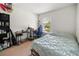 Bedroom with a double bed, desk and window at 17539 Balmaha Dr, Land O Lakes, FL 34638