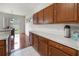 Kitchen featuring wood cabinets and a large countertop at 17539 Balmaha Dr, Land O Lakes, FL 34638