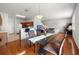 Bright dining area with glass table and access to kitchen at 17539 Balmaha Dr, Land O Lakes, FL 34638