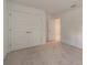 Bright bedroom with double doors leading to a spacious closet at 7203 S De Soto St, Tampa, FL 33616