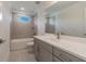 Modern bathroom with gray vanity, quartz countertop and bathtub at 7203 S De Soto St, Tampa, FL 33616
