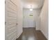 Bright entryway with hardwood floors, white walls, and staircase at 7203 S De Soto St, Tampa, FL 33616