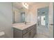 Clean bathroom with gray vanity, quartz countertop and mirror at 7203 S De Soto St, Tampa, FL 33616