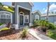 Front entrance with navy door and walkway at 19211 Pelican Ridge Ln, Tampa, FL 33647