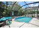 Inviting screened pool area with lounge chairs and seating at 19211 Pelican Ridge Ln, Tampa, FL 33647