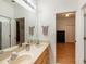 Double vanity bathroom with view into bedroom at 19211 Pelican Ridge Ln, Tampa, FL 33647