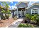 Gray house with landscaping and walkway at 19211 Pelican Ridge Ln, Tampa, FL 33647