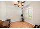 Well-lit bedroom with hardwood floors and a large window at 19211 Pelican Ridge Ln, Tampa, FL 33647
