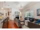 Spacious living room with hardwood floors, fireplace and access to the pool at 19211 Pelican Ridge Ln, Tampa, FL 33647
