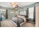 Main bedroom with four-poster bed and built-in shelving at 19211 Pelican Ridge Ln, Tampa, FL 33647