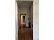 Hallway with wood floors and a view to a staircase at 3008 N Nebraska Ave, Tampa, FL 33603