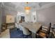 Bright dining room with a large table and statement chandelier at 4919 W Melrose S Ave, Tampa, FL 33629