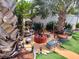 Relaxing fire pit area with seating, surrounded by tropical plants at 1209 Croydonwood Cir, Brandon, FL 33510