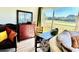 Living room with water views and vintage furniture at 1041 Capri Isles Blvd # 219, Venice, FL 34292