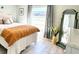Bedroom with a queen bed and large window at 1041 Capri Isles Blvd # 219, Venice, FL 34292