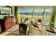 Living room with water views and a workspace at 1041 Capri Isles Blvd # 219, Venice, FL 34292