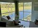 Living room with water views and comfy seating at 1041 Capri Isles Blvd # 219, Venice, FL 34292