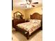 Bright bedroom featuring a ceiling fan and wooden furniture at 4507 9Th W St # E8, Bradenton, FL 34207