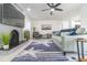 Spacious living room with light green couch and a starfish rug at 7608 20Th Nw Ave, Bradenton, FL 34209
