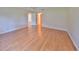 This large bedroom boasts pristine wood floors and neutral walls, creating a bright, airy space at 2620 Locksley St # 261, Sun City Center, FL 33573