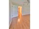 Bright bedroom with hardwood floors and a door to a walk-in closet, offering comfort and space at 2620 Locksley St # 261, Sun City Center, FL 33573