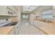 Bright eat-in kitchen features white appliances and tile floors at 2620 Locksley St # 261, Sun City Center, FL 33573