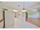 Spacious kitchen featuring a tiled floor, white appliances and lots of counter space at 2620 Locksley St # 261, Sun City Center, FL 33573