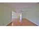 Spacious living room with beautiful wood floors and a ceiling fan that provides ample circulation at 2620 Locksley St # 261, Sun City Center, FL 33573