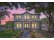 Two-story house with white siding, gray trim, and a metal roof at 325 33Rd N Ave, St Petersburg, FL 33704