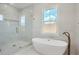 Elegant bathroom featuring a freestanding tub and glass shower enclosure at 325 33Rd N Ave, St Petersburg, FL 33704