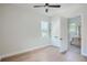 Bedroom with hardwood floors, en-suite bathroom, and ceiling fan at 325 33Rd N Ave, St Petersburg, FL 33704