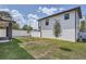 Landscaped backyard with grassy area and white fence at 325 33Rd N Ave, St Petersburg, FL 33704