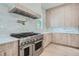 Bright kitchen featuring stainless steel range, marble backsplash and light wood cabinets at 325 33Rd N Ave, St Petersburg, FL 33704
