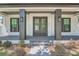 Front entrance with double doors, gray columns, and brick walkway at 325 33Rd N Ave, St Petersburg, FL 33704
