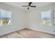 Spacious bedroom with hardwood floors and two windows at 325 33Rd N Ave, St Petersburg, FL 33704