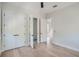Bright bedroom with hardwood floors, double doors, and en-suite bathroom at 325 33Rd N Ave, St Petersburg, FL 33704