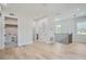 Light-filled hallway with hardwood floors and access to laundry and bathroom at 325 33Rd N Ave, St Petersburg, FL 33704