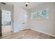 Spacious bedroom with hardwood floors, double door closet and access to upper hallway at 325 33Rd N Ave, St Petersburg, FL 33704