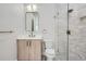 Modern bathroom with a walk-in shower, marble vanity, and gold fixtures at 325 33Rd N Ave, St Petersburg, FL 33704