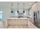 Open concept kitchen with large island, stainless steel appliances, and white countertops at 325 33Rd N Ave, St Petersburg, FL 33704