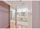 Bathroom with double vanity, mirrored closet, and tile flooring at 2620 Locksley St # 261, Sun City Center, FL 33573