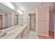 Bright bathroom with double vanity and shower at 2620 Locksley St # 261, Sun City Center, FL 33573