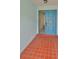 Bright entryway with terracotta tile flooring and a light blue door at 2620 Locksley St # 261, Sun City Center, FL 33573