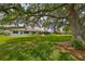 House with large backyard and green grass at 2620 Locksley St # 261, Sun City Center, FL 33573