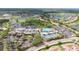 Aerial view of community with pool, golf course, and clubhouse at 2620 Locksley St # 261, Sun City Center, FL 33573